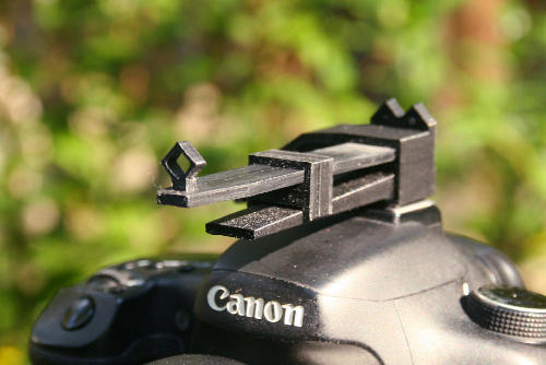 Adjustable telephoto sight for hot shoe